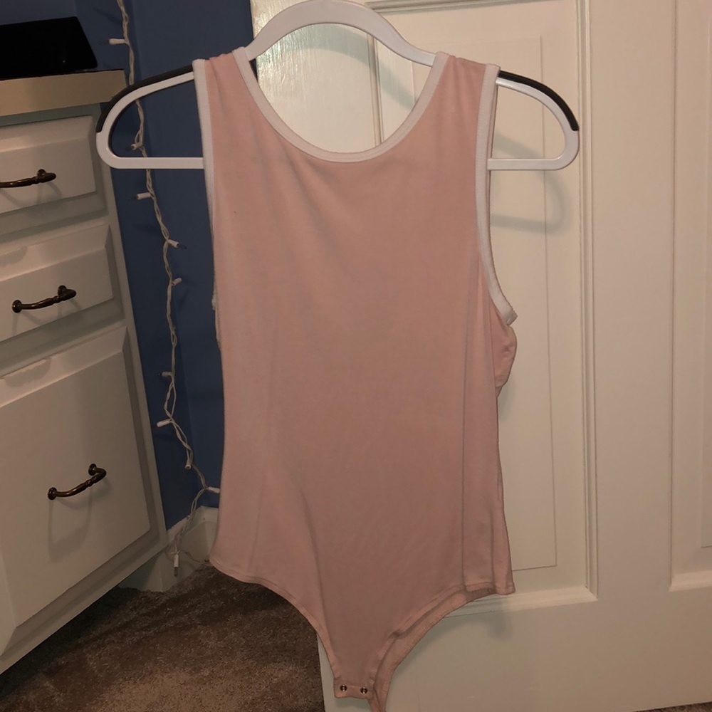 Pale pink bodysuit. Never worn.